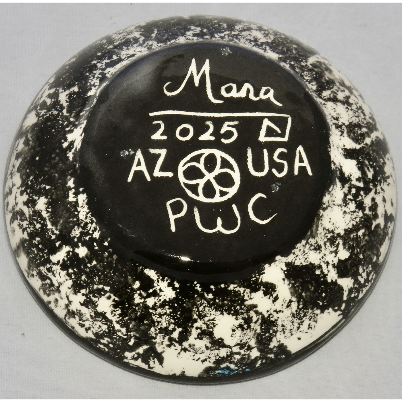 Photo of Mana Pottery Holy Bowl featuring roadrunner on turquoise background, and black and white marbled underside.