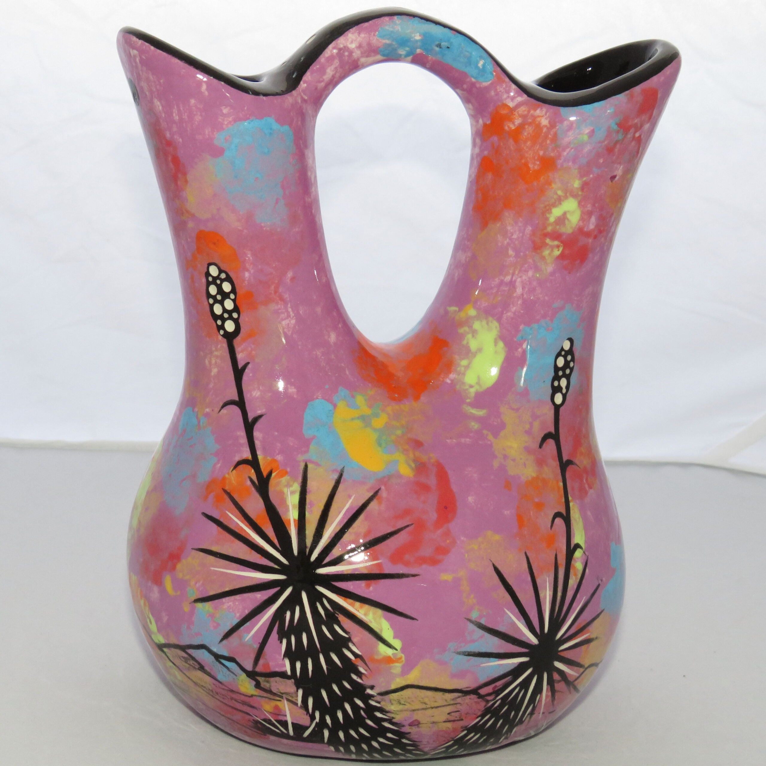 Photo of Mana Pottery medium wedding vase featuring 2 butterflies and desert landscape on light purple background