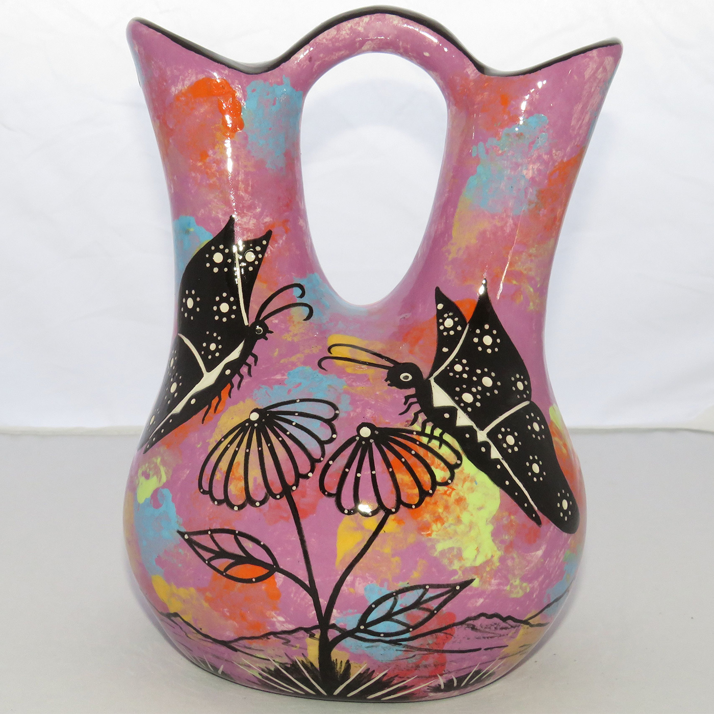 Photo of Mana Pottery medium wedding vase featuring 2 butterflies and desert landscape on light purple background