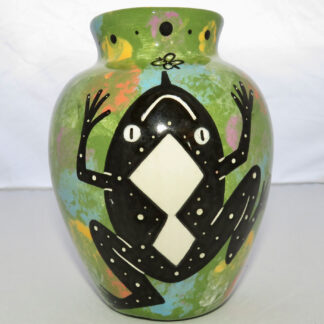 Photo of Mana Pottery Six Inch Vase featuring toad on one side and desert plants on reverse, all on a lime green background.