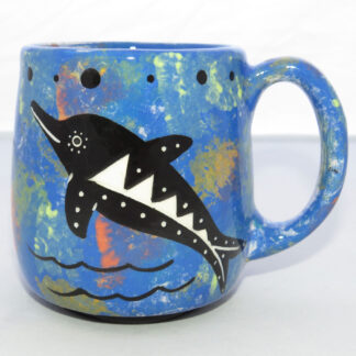 Image of Mana Pottery Country Cup featuring dolphin leaping from sea and desert landscape on reverse, all on a background of blue.