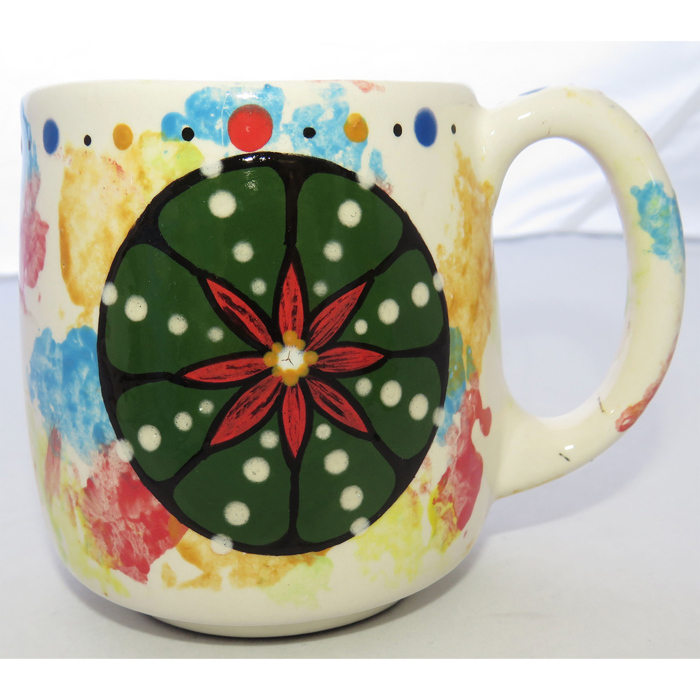 Image of Mana Pottery Country Cup featuring Peyote in bloom and desert landscape on reverse sides, on a confetti-style background.