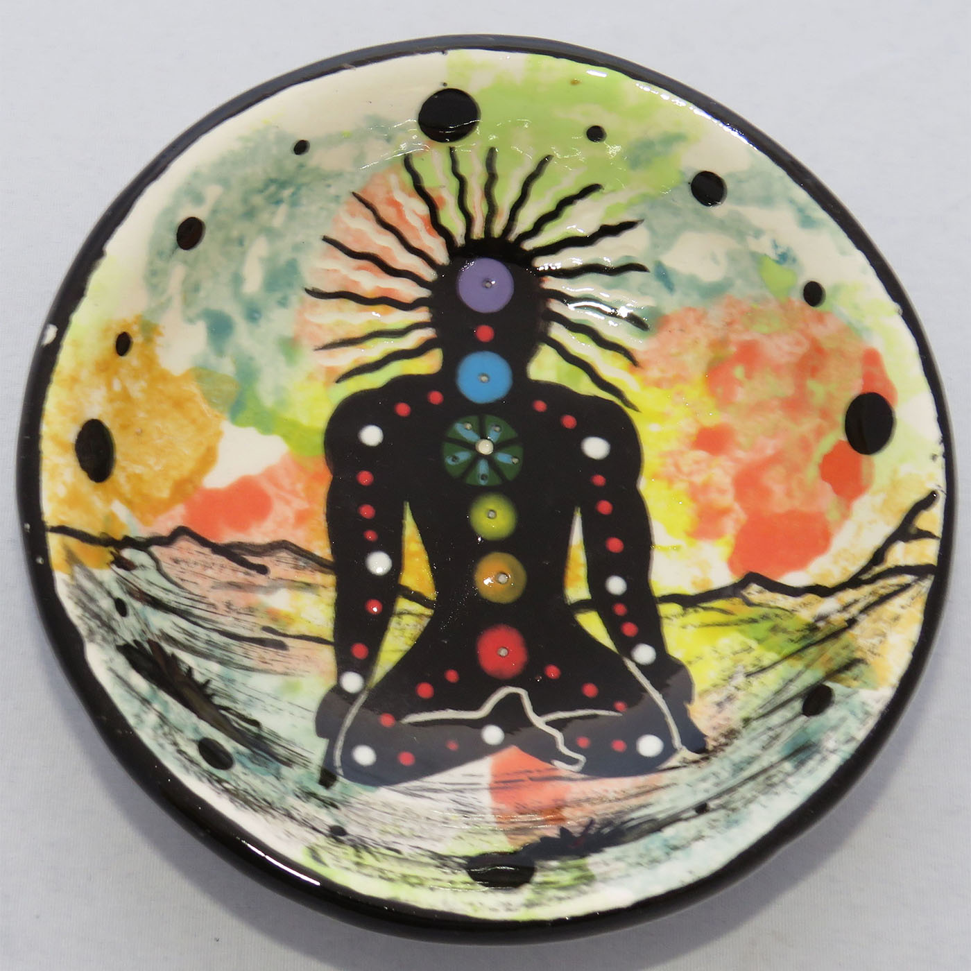 Image of Mana Pottery Holy Bowl featuring the Chakra Being on confetti style background.