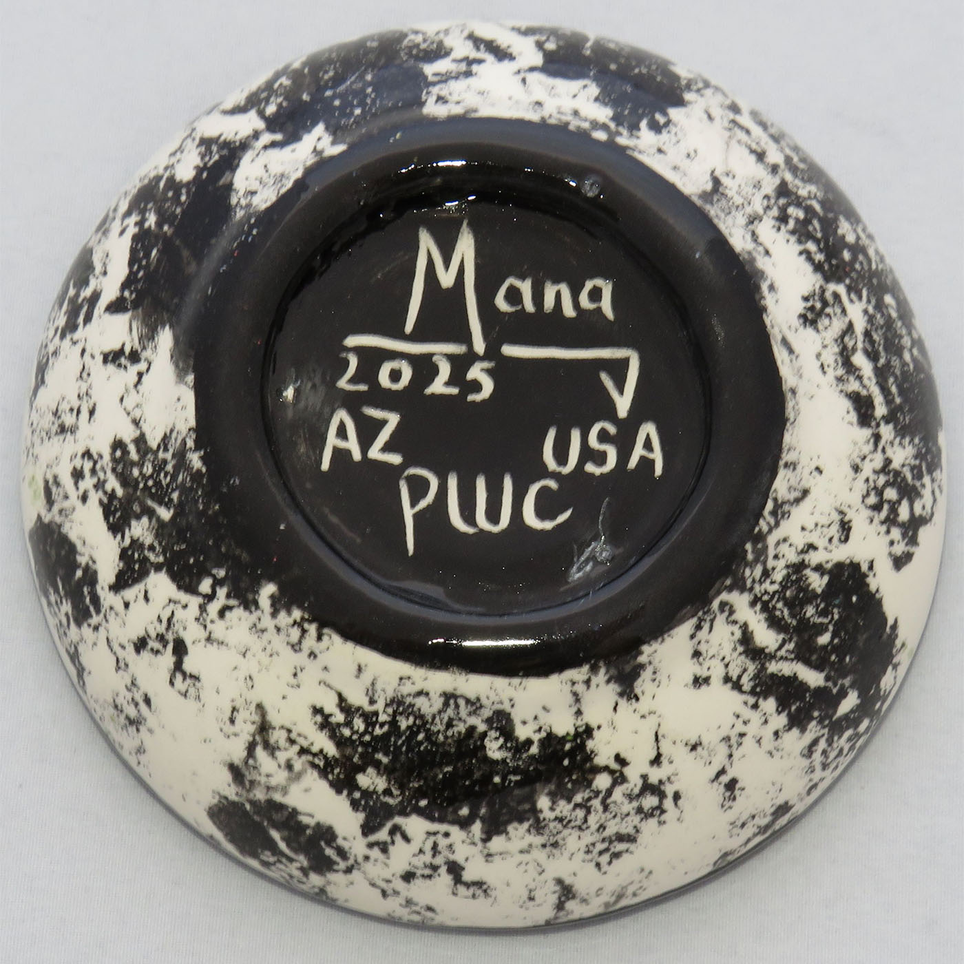 Image of Mana Pottery Holy Bowl featuring the Chakra Being on green. This view shows the black and white underside.