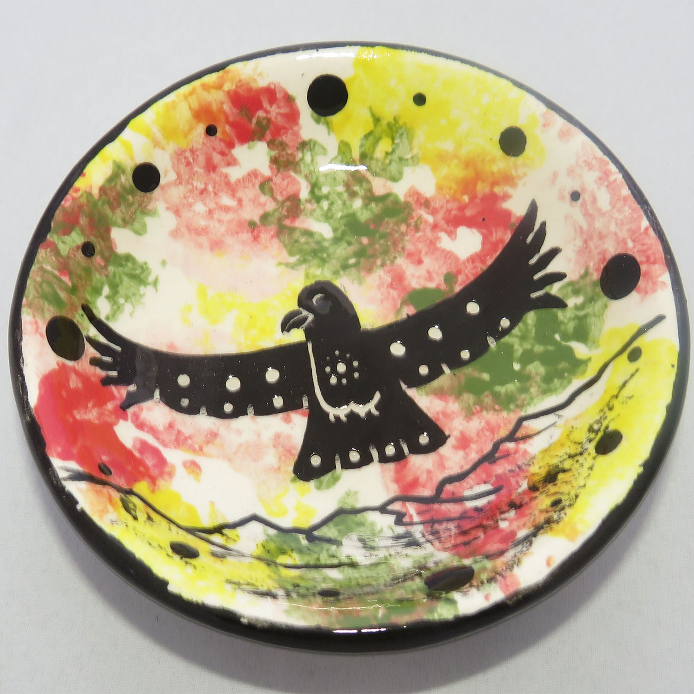 Image of Mana Pottery Holy Bowl featuring hawk in flight, high in a brightly colored desert sky.