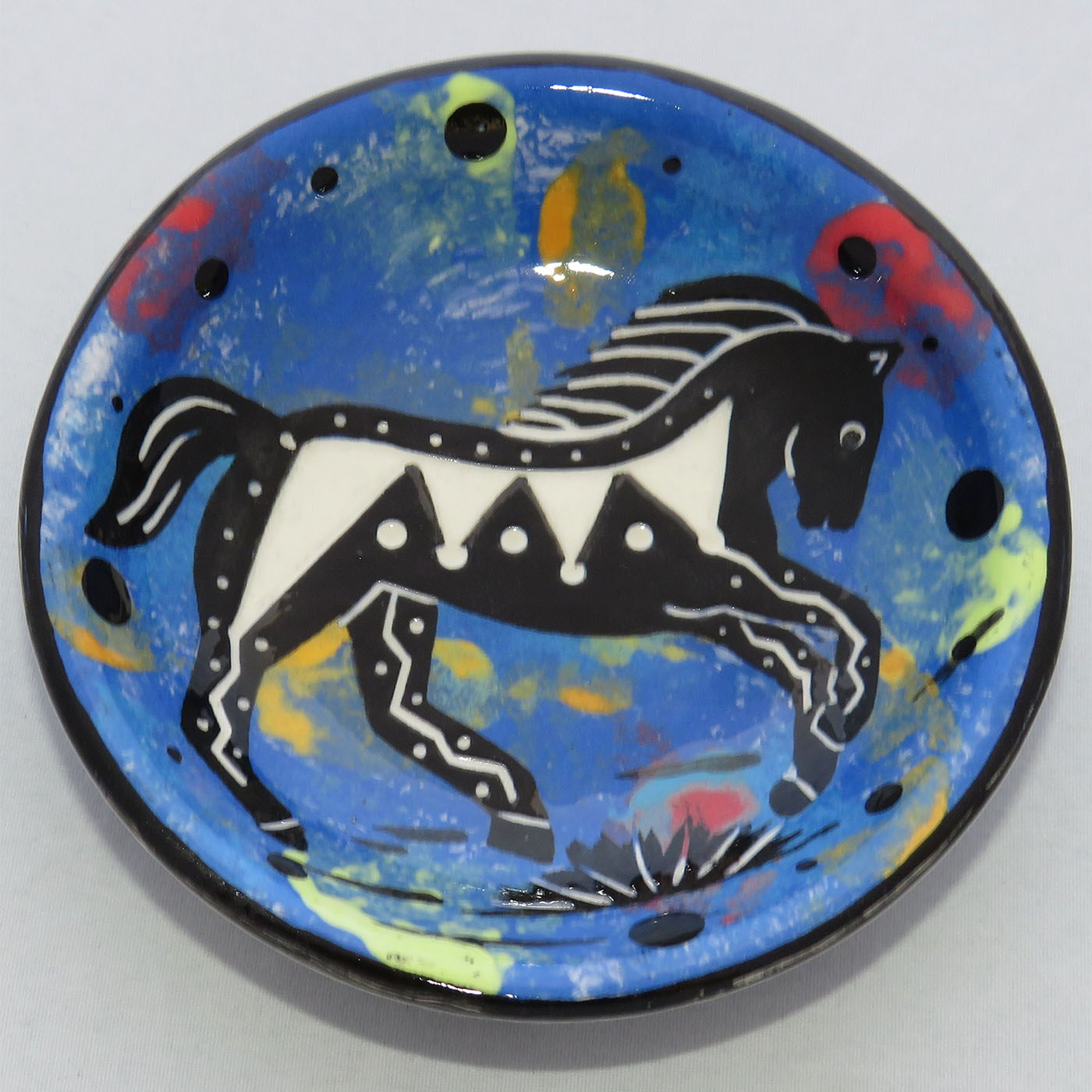 Image of Mana Pottery Holy Bowl featuring horse on on a blue background.