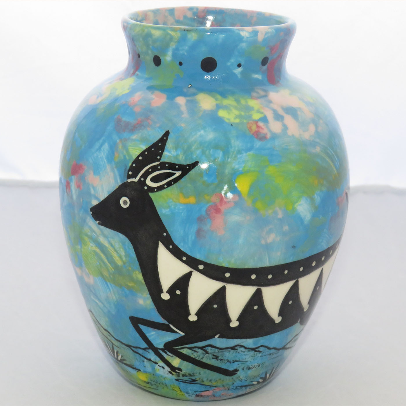 Image of Mana Pottery Six Inch Vase featuring deer running through desert on turquoise blue background.