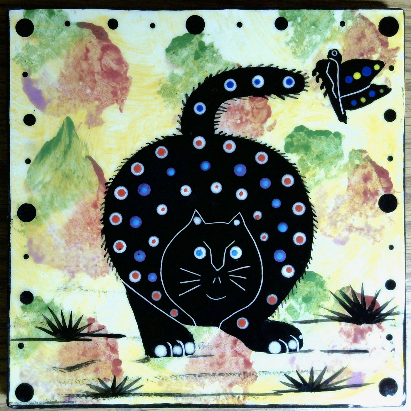 Image of Mana Pottery 6" tile featuring cat and butterfly
