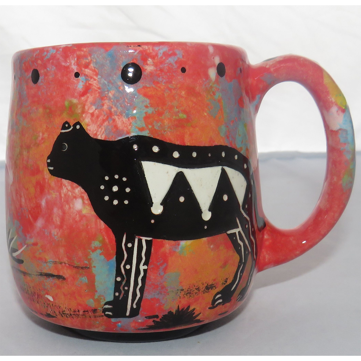 Image of Mana Pottery Country Cup featuring a Puma lion on one side and yucca plants on the other, all on a rose mix background.