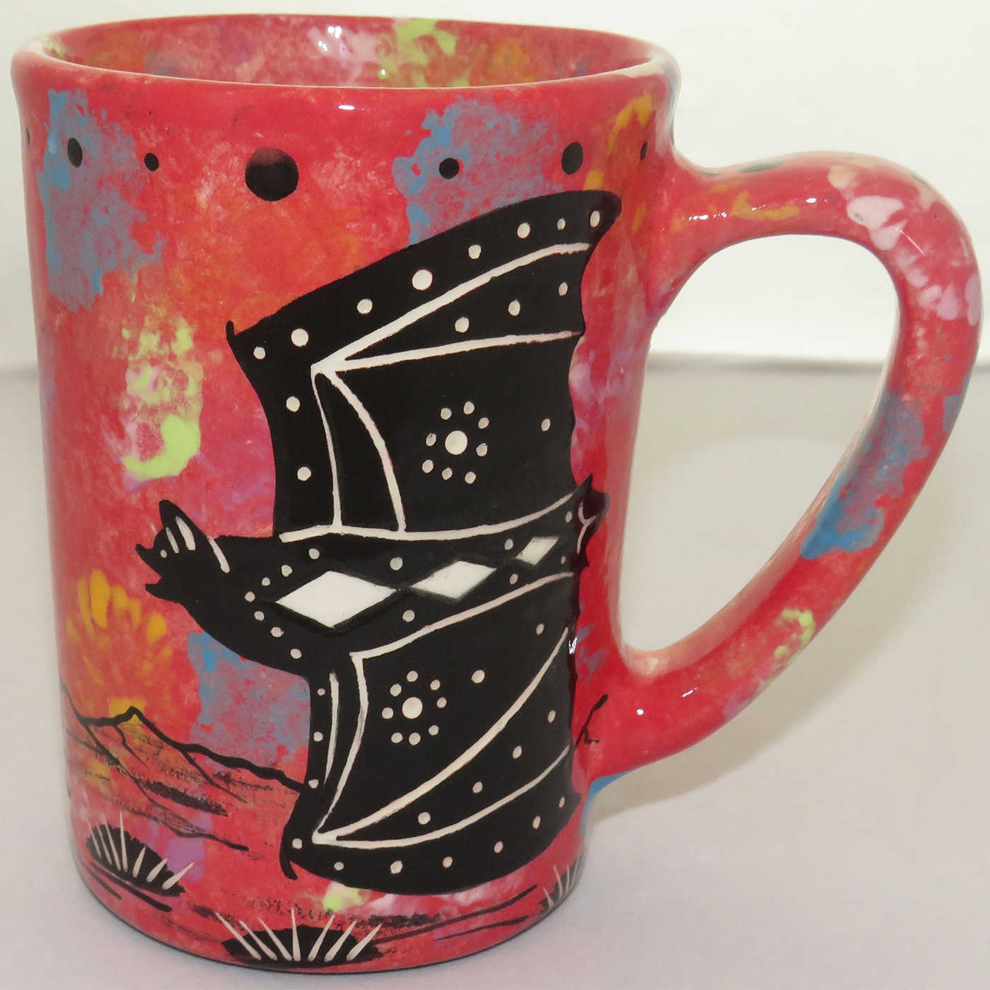 Image showing Mana Pottery Large Mug featuring bat on rose. Reverse shows desertscape.