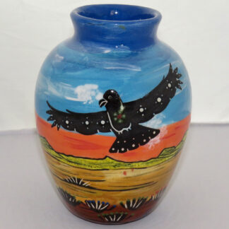 Image of Mana Pottery Six Inch Vase featuring hawk in flight on one side and howling coyote on the other, against desert and flame red sky.